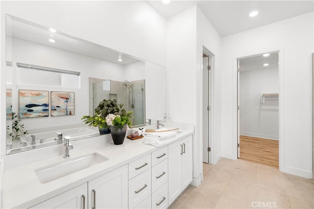 120 Yugen, Irvine, CA 92618 - bathroom with a shower stall, double vanity, a walk in closet, a bath, and recessed lighting