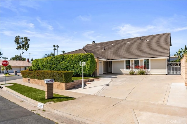 5291 Strasbourg Ave, Irvine, CA 92604 - ranch-style home with driveway, a tiled roof, and a garage