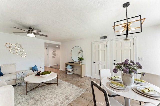 5291 Strasbourg Ave, Irvine, CA 92604 - living room with light tile patterned flooring, a chandelier, a textured ceiling, and a ceiling fan