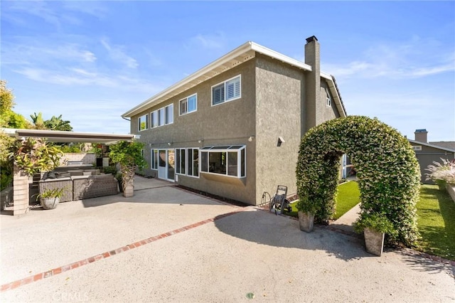 5291 Strasbourg Ave, Irvine, CA 92604 - back of property featuring a patio area, a chimney, and stucco siding