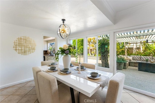 5291 Strasbourg Ave, Irvine, CA 92604 - dining area with light tile patterned floors, baseboards, ornamental molding, and a chandelier