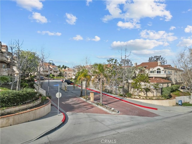 19852 Sandpiper Pl Unit 96, Newhall, CA 91321 - view of decorative street with a residential view, sidewalks, curbs, and traffic signs