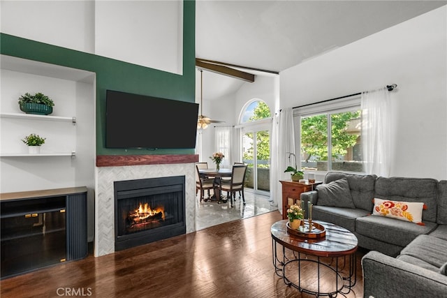 19852 Sandpiper Pl Unit 96, Newhall, CA 91321 - living room featuring a fireplace, wood finished floors, ceiling fan, beam ceiling, and high vaulted ceiling