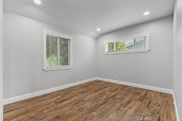 6711 Rhea Ave, Reseda, CA 91335 - empty room featuring recessed lighting, baseboards, dark wood finished floors, and vaulted ceiling