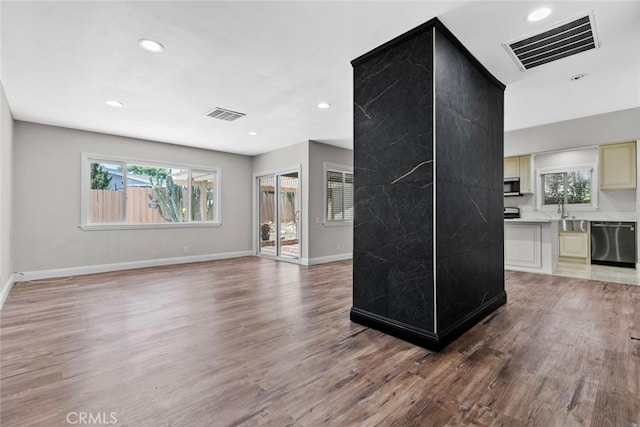 6711 Rhea Ave, Reseda, CA 91335 - unfurnished living room featuring plenty of natural light, recessed lighting, light wood finished floors, and baseboards