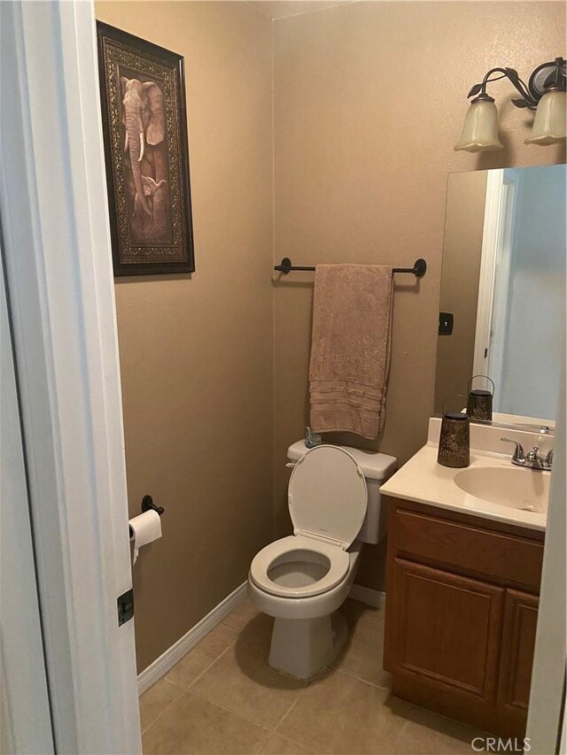 30710 Tierra Linda Ct, Menifee, CA 92584 - bathroom featuring vanity, toilet, tile patterned floors, and baseboards
