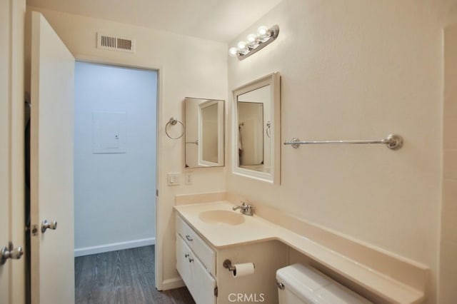 45 Via Hermosa, Rancho Santa Margarita, CA 92688 - half bathroom featuring toilet, vanity, wood finished floors, and baseboards