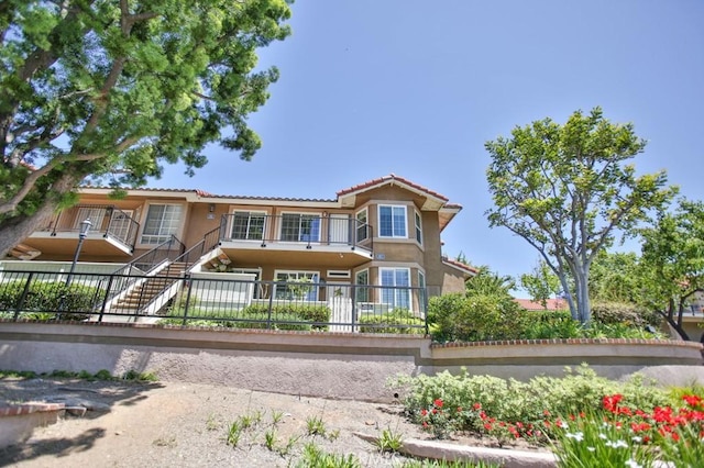 45 Via Hermosa, Rancho Santa Margarita, CA 92688 - view of front of home with stucco siding, a tile roof, and stairs