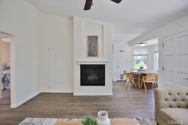 45 Via Hermosa, Rancho Santa Margarita, CA 92688 - living area with ceiling fan, a fireplace, wood finished floors, and baseboards