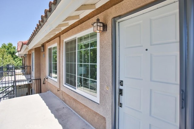 45 Via Hermosa, Rancho Santa Margarita, CA 92688 - view of exterior entry featuring stucco siding and a tiled roof