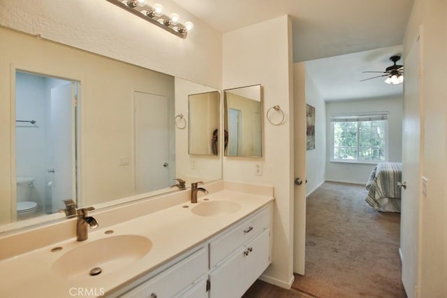 45 Via Hermosa, Rancho Santa Margarita, CA 92688 - bathroom with double vanity, toilet, ensuite bathroom, a ceiling fan, and baseboards