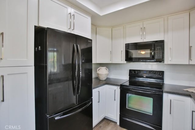 45 Via Hermosa, Rancho Santa Margarita, CA 92688 - kitchen featuring black appliances, dark countertops, and white cabinetry