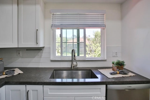 45 Via Hermosa, Rancho Santa Margarita, CA 92688 - kitchen featuring a sink, dark countertops, stainless steel dishwasher, and white cabinets
