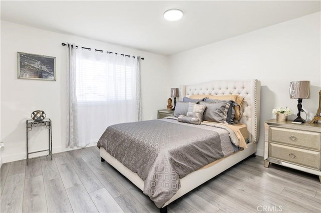 4429 Tremont St Unit 4, San Diego, CA 92102 - bedroom with light wood finished floors and baseboards