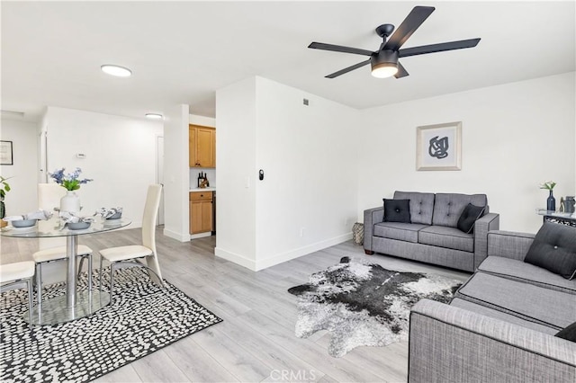 4429 Tremont St Unit 4, San Diego, CA 92102 - living room featuring light wood-style floors, a ceiling fan, and baseboards