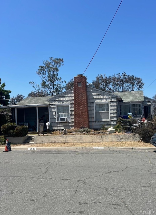 2537 E 13th St, National City, CA 91950 - view of side of home with a chimney