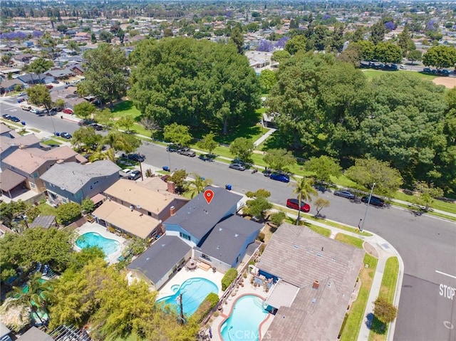 8754 Prichard St, Downey, CA 90242 - aerial overview of property's location featuring a pool area and nearby suburban area