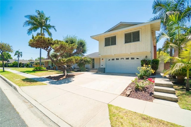 8754 Prichard St, Downey, CA 90242 - view of front of home featuring a garage and concrete driveway