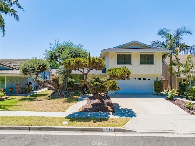8754 Prichard St, Downey, CA 90242 - view of front of home featuring a garage and concrete driveway