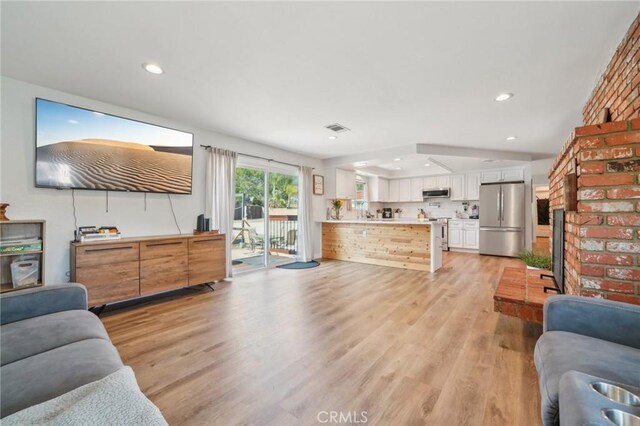 7906 Appaloosa Ct, Rancho Cucamonga, CA 91701 - living room with light wood-style flooring and recessed lighting
