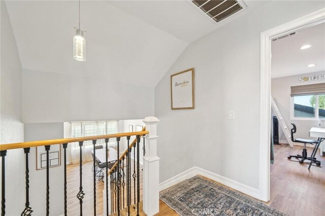 7906 Appaloosa Ct, Rancho Cucamonga, CA 91701 - staircase with wood finished floors, baseboards, lofted ceiling, and recessed lighting