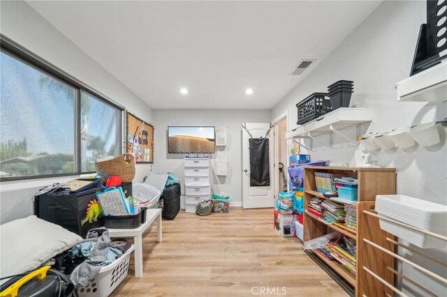 7906 Appaloosa Ct, Rancho Cucamonga, CA 91701 - rec room with wood finished floors and recessed lighting