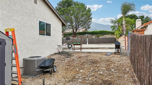 7906 Appaloosa Ct, Rancho Cucamonga, CA 91701 - view of yard with central AC unit and a mountain view