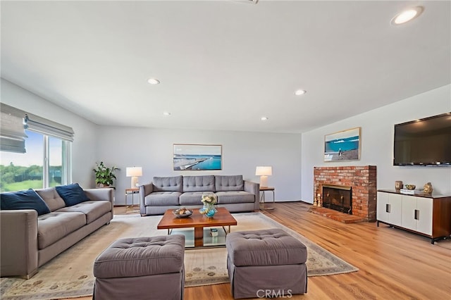 7906 Appaloosa Ct, Rancho Cucamonga, CA 91701 - living room featuring recessed lighting, light wood finished floors, and a brick fireplace