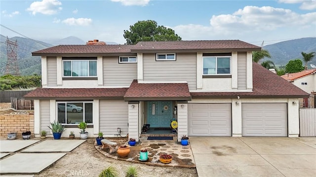 7906 Appaloosa Ct, Rancho Cucamonga, CA 91701 - view of front of property featuring a mountain view, concrete driveway, a shingled roof, and a garage