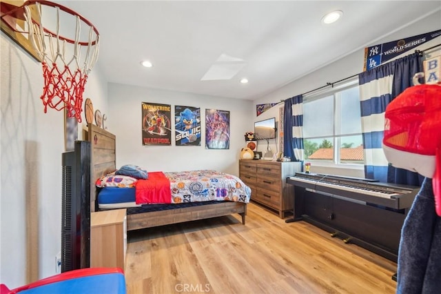 7906 Appaloosa Ct, Rancho Cucamonga, CA 91701 - bedroom with wood finished floors, recessed lighting, and a skylight