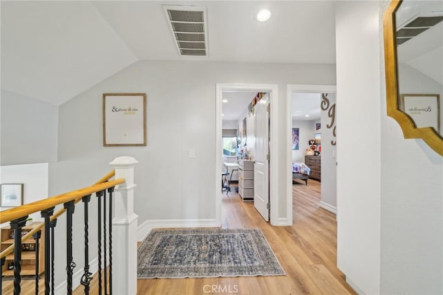 7906 Appaloosa Ct, Rancho Cucamonga, CA 91701 - hall featuring light wood-type flooring, an upstairs landing, recessed lighting, baseboards, and vaulted ceiling