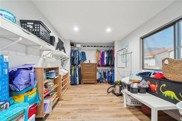 7906 Appaloosa Ct, Rancho Cucamonga, CA 91701 - spacious closet featuring wood finished floors
