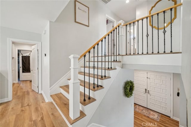 7906 Appaloosa Ct, Rancho Cucamonga, CA 91701 - staircase with wood finished floors and baseboards