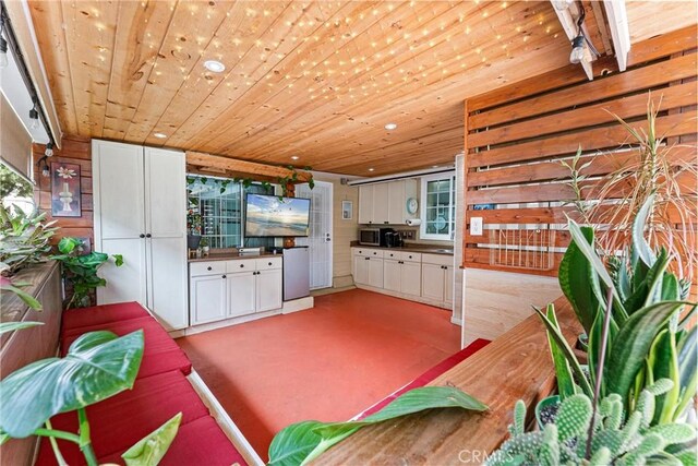 20402 Pioneer Blvd, Lakewood, CA 90715 - living room featuring wooden ceiling and wooden walls