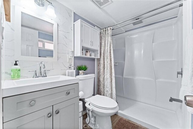 20402 Pioneer Blvd, Lakewood, CA 90715 - bathroom featuring vanity, toilet, and curtained shower