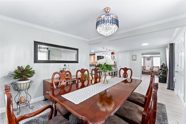 20402 Pioneer Blvd, Lakewood, CA 90715 - dining space with light wood-style floors, a chandelier, baseboards, and crown molding