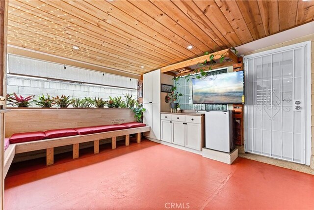 20402 Pioneer Blvd, Lakewood, CA 90715 - interior space with finished concrete floors, wooden ceiling, and white cabinetry