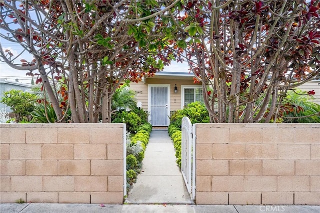 20402 Pioneer Blvd, Lakewood, CA 90715 - view of property hidden behind natural elements with a fenced front yard