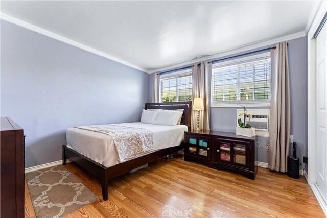 20402 Pioneer Blvd, Lakewood, CA 90715 - bedroom featuring light wood-style flooring, crown molding, cooling unit, and baseboards
