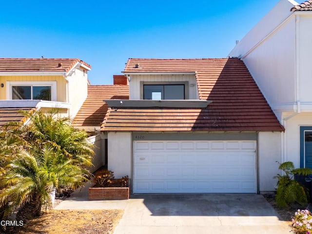 4320 Meridian Ave, Oxnard, CA 93035 - view of front facade with driveway, a tile roof, and stucco siding