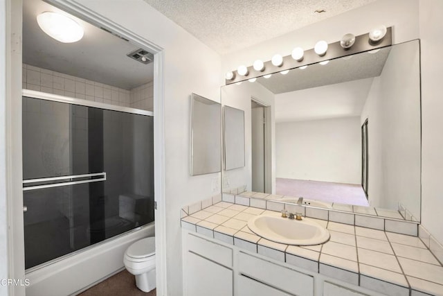 4320 Meridian Ave, Oxnard, CA 93035 - bathroom featuring vanity, enclosed tub / shower combo, and a textured ceiling