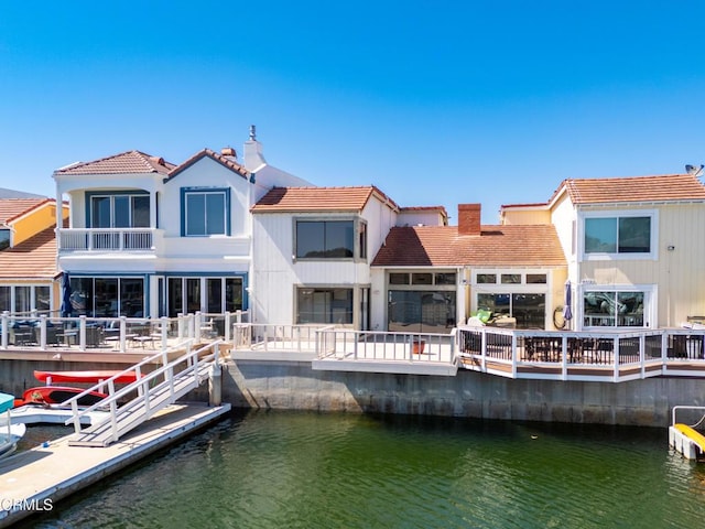 4320 Meridian Ave, Oxnard, CA 93035 - back of property featuring a water view, a tile roof, and a chimney