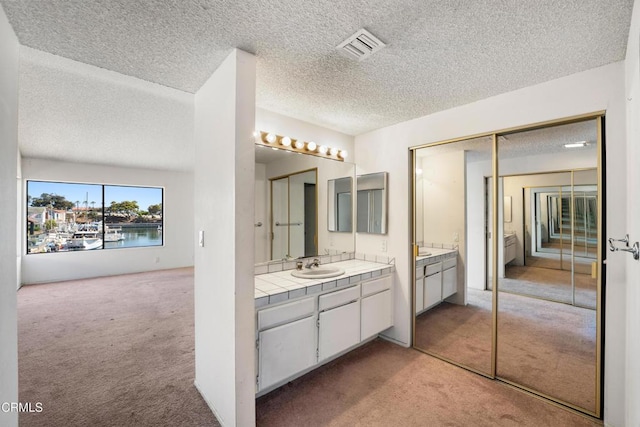 4320 Meridian Ave, Oxnard, CA 93035 - full bath featuring vanity and a textured ceiling