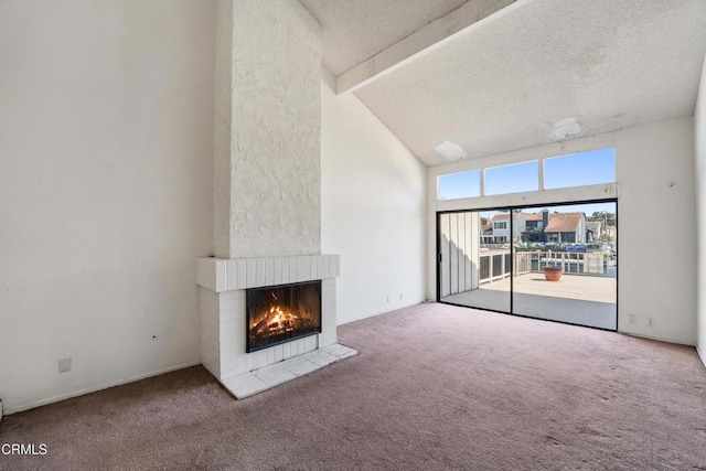4320 Meridian Ave, Oxnard, CA 93035 - unfurnished living room featuring carpet, a fireplace, a textured ceiling, beamed ceiling, and high vaulted ceiling