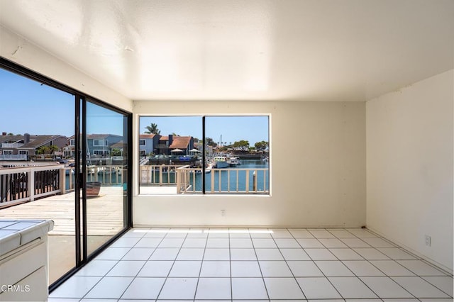 4320 Meridian Ave, Oxnard, CA 93035 - empty room with a water view, a residential view, and light tile patterned floors