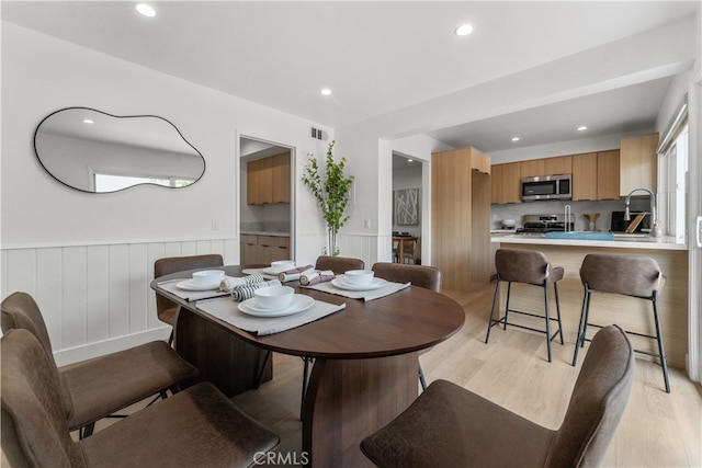 17878 La Lima St, Fountain Valley, CA 92708 - dining area featuring light wood-style flooring, wainscoting, and recessed lighting