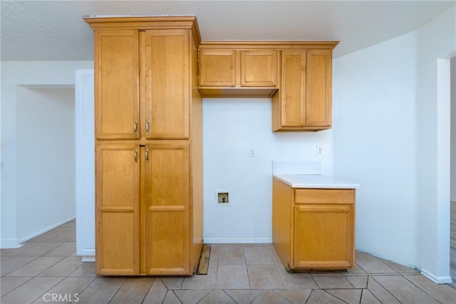 4231 Sage Ct, Palmdale, CA 93552 - kitchen featuring light tile patterned flooring, baseboards, and light countertops