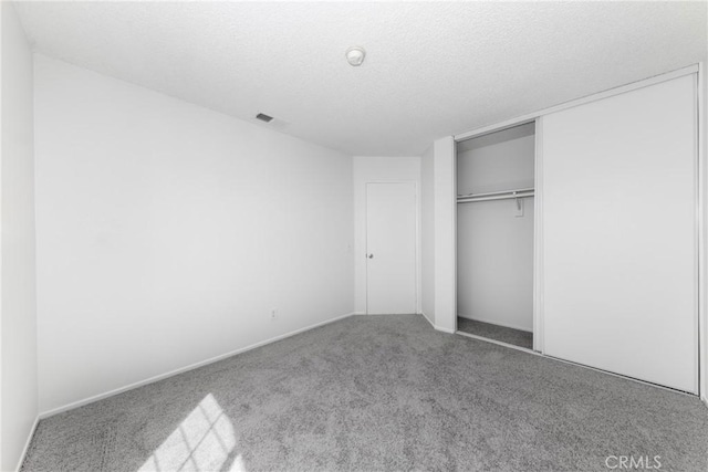 4231 Sage Ct, Palmdale, CA 93552 - unfurnished bedroom featuring carpet, a closet, a textured ceiling, and baseboards