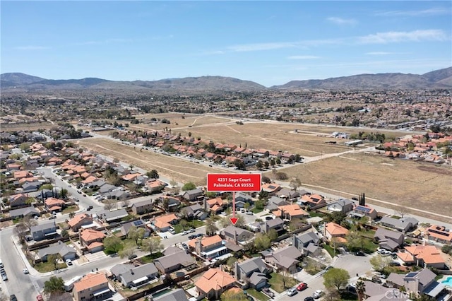 4231 Sage Ct, Palmdale, CA 93552 - aerial overview of property's location featuring a mountain backdrop and nearby suburban area