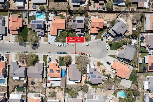 4231 Sage Ct, Palmdale, CA 93552 - aerial view of property and surrounding area featuring nearby suburban area and a pool area